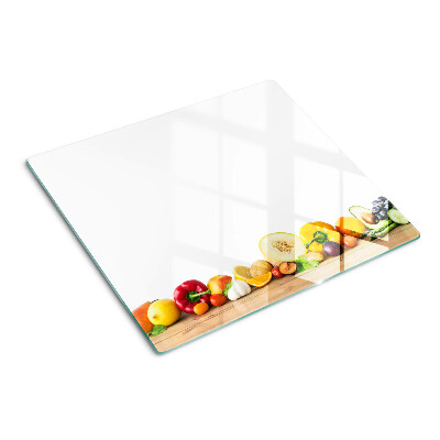 Tabla de cortar de cristal Fruta en una tabla
