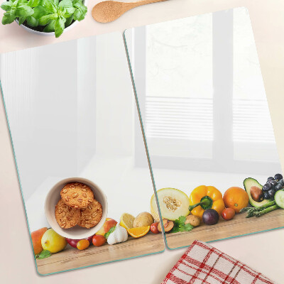 Tabla de cortar de cristal Fruta en una tabla