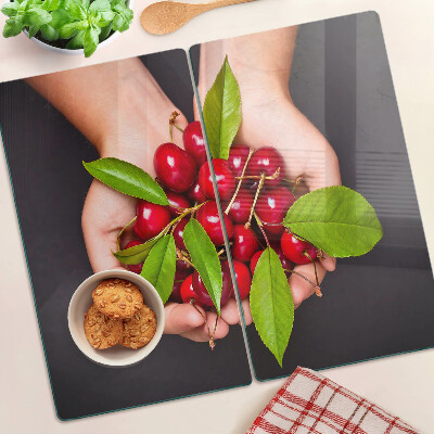 Tabla de cortar de cristal Cerezas rojas en las manos