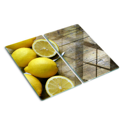 Tabla de cortar de cristal Limones sobre un fondo de madera