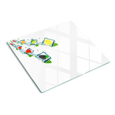 Tabla de cortar de cristal Motivo de fruta con rodajas de colores.