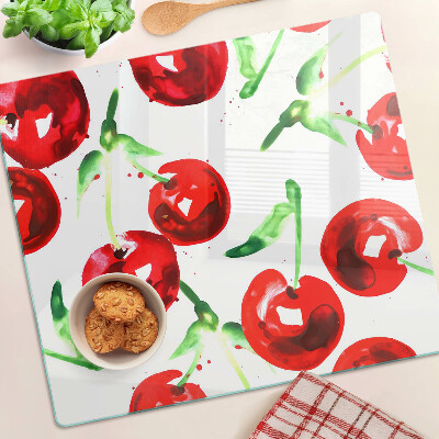 Tabla de cortar de cristal Cerezas rojas sobre un fondo blanco