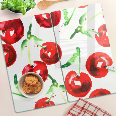 Tabla de cortar de cristal Cerezas rojas sobre un fondo blanco