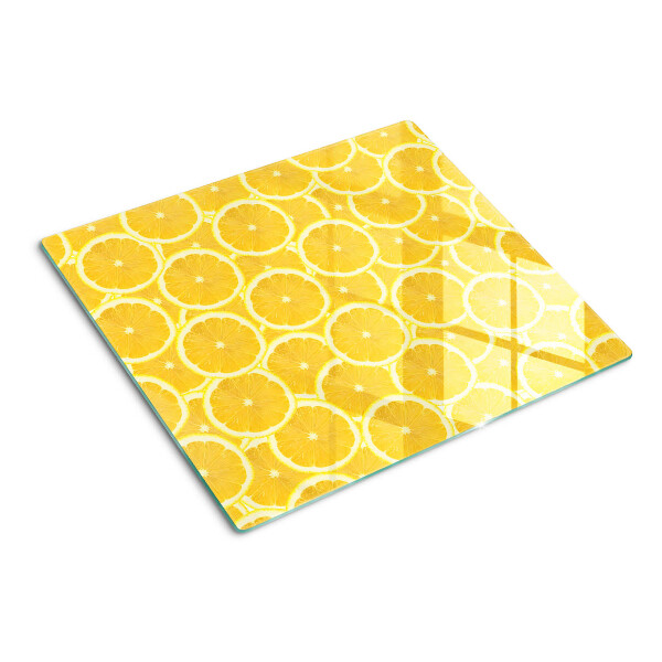 Tabla para cortar Rodajas de limón sobre un fondo amarillo