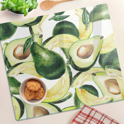 Tabla para cortar Aguacate sobre un fondo de hojas