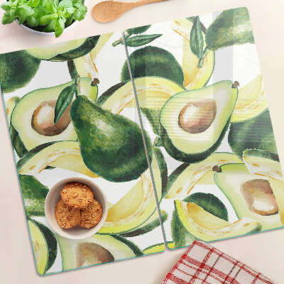 Tabla para cortar Aguacate sobre un fondo de hojas