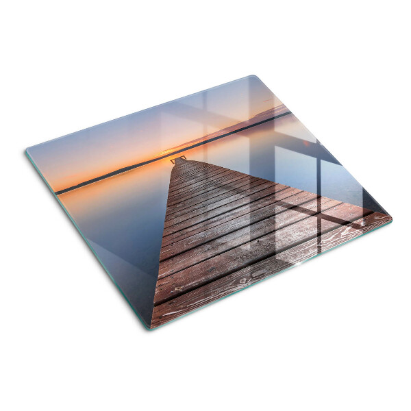 Tabla de cortar de cristal Muelle en el lago al atardecer