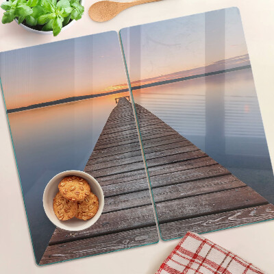 Tabla de cortar de cristal Muelle en el lago al atardecer