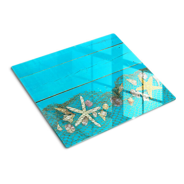 Tabla de cortar de cristal Conchas y estrellas de mar en una red