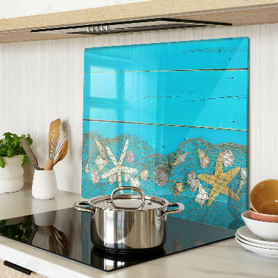 Tabla de cortar de cristal Conchas y estrellas de mar en una red