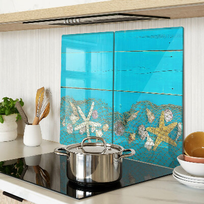 Tabla de cortar de cristal Conchas y estrellas de mar en una red