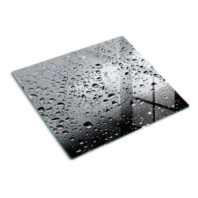 Tabla de cortar de cristal Gotas de agua sobre el vidrio