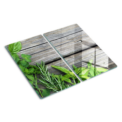 Tabla de cortar de cristal Hierbas verdes sobre fondo de madera
