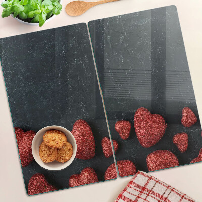 Tabla para cortar Corazones rojos sobre un fondo oscuro
