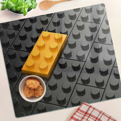 Tabla de cortar de cristal Ladrillos LEGO sobre fondo negro