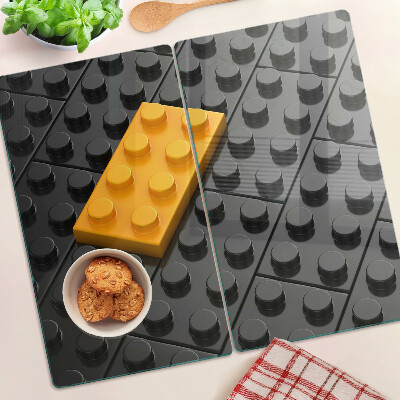 Tabla de cortar de cristal Ladrillos LEGO sobre fondo negro