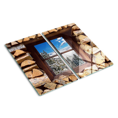 Tabla de cortar de cristal Vista de un paisaje invernal a través de la ventana.