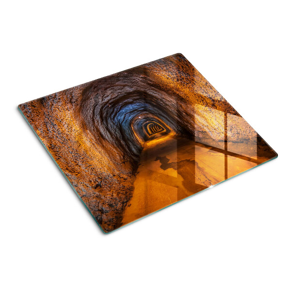 Tabla de cortar de cristal Túnel en la cueva con iluminación.