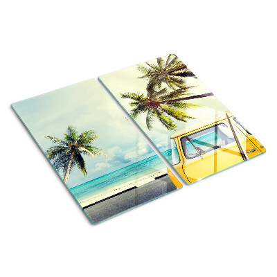 Tabla para cortar Playa con palmeras y un coche.