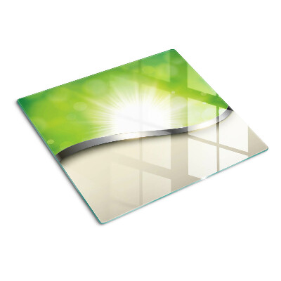 Tabla de cortar de cristal Bokeh verde con rayos de luz