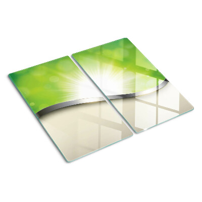 Tabla de cortar de cristal Bokeh verde con rayos de luz