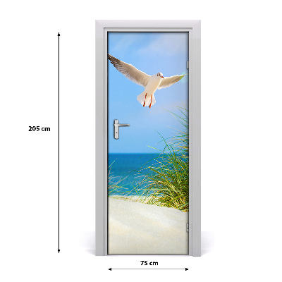 Vinilo para puerta Gaviota sobrevolando las dunas