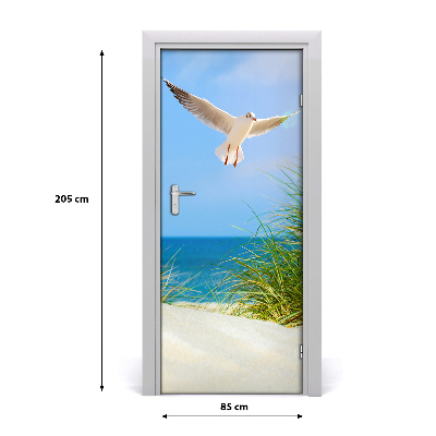 Vinilo para puerta Gaviota sobrevolando las dunas