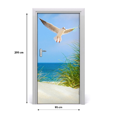 Vinilo para puerta Gaviota sobrevolando las dunas