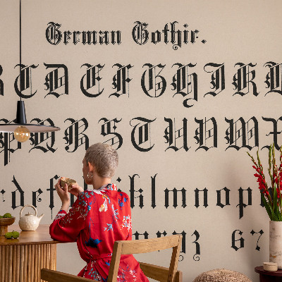 Papel mural con patrón decorativo con motivo de letras góticas