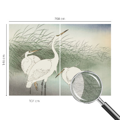 Mural decorativo con diseño de garzas entre la hierba