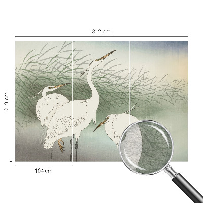 Mural decorativo con diseño de garzas entre la hierba