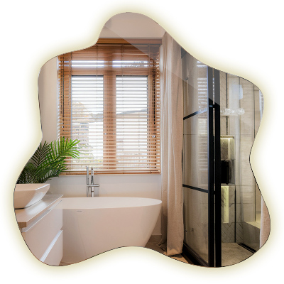 Espejo en forma de mancha con iluminación LED