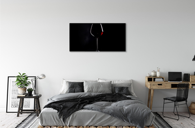 Cuadros sobre lienzo Fondo negro con una copa de vino