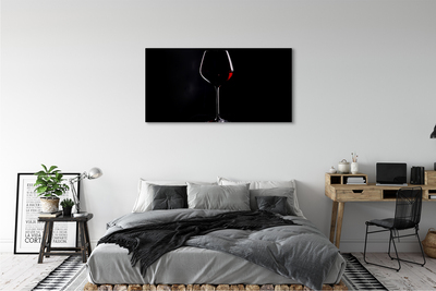 Cuadros sobre lienzo Fondo negro con una copa de vino