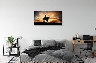 Cuadros sobre lienzo Mujer en la puesta del sol unicornio