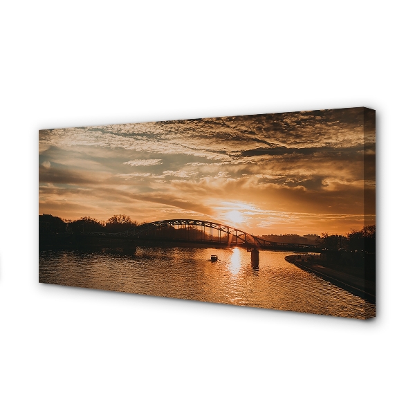 Cuadros sobre lienzo Cracovia puente del río de la puesta del sol