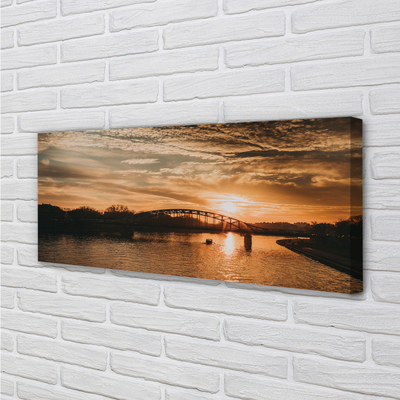 Cuadros sobre lienzo Cracovia puente del río de la puesta del sol