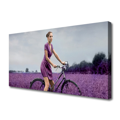 Cuadro en lienzo canvas Mujer bicicleta prado hombre