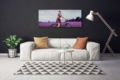 Cuadro en lienzo canvas Mujer bicicleta prado hombre