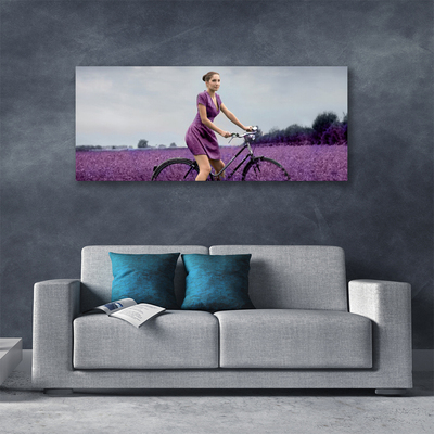 Cuadro en lienzo canvas Mujer bicicleta prado hombre
