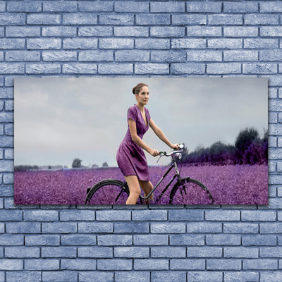 Cuadro en lienzo canvas Mujer bicicleta prado hombre