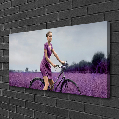 Cuadro en lienzo canvas Mujer bicicleta prado hombre
