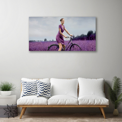 Cuadro en lienzo canvas Mujer bicicleta prado hombre