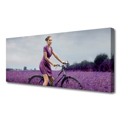 Cuadro en lienzo canvas Mujer bicicleta prado hombre