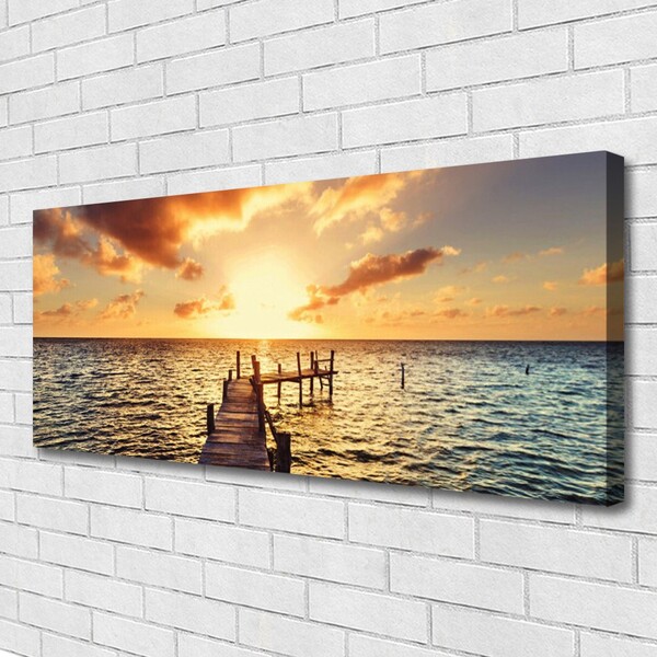 Cuadro en lienzo canvas Puente mar puesta de sol vistas