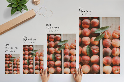 Póster Melocotones con hojas en una caja de madera
