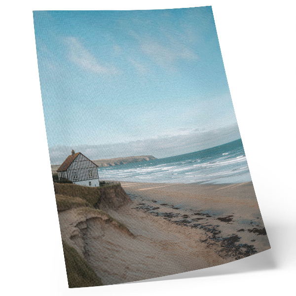 Póster Playa, olas, casa en un acantilado, colores pastel