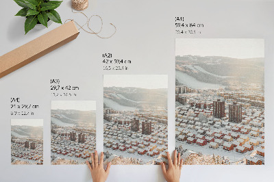 Póster con colores saturados Paisaje invernal con casas cubiertas de nieve