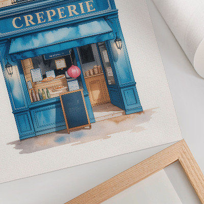 Lienzo decorativo moderno La fachada azul de un café en una calle encantadora.