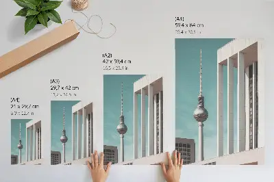 Lienzo decorativo moderno torre minimalista con edificios modernos bajo un cielo azul